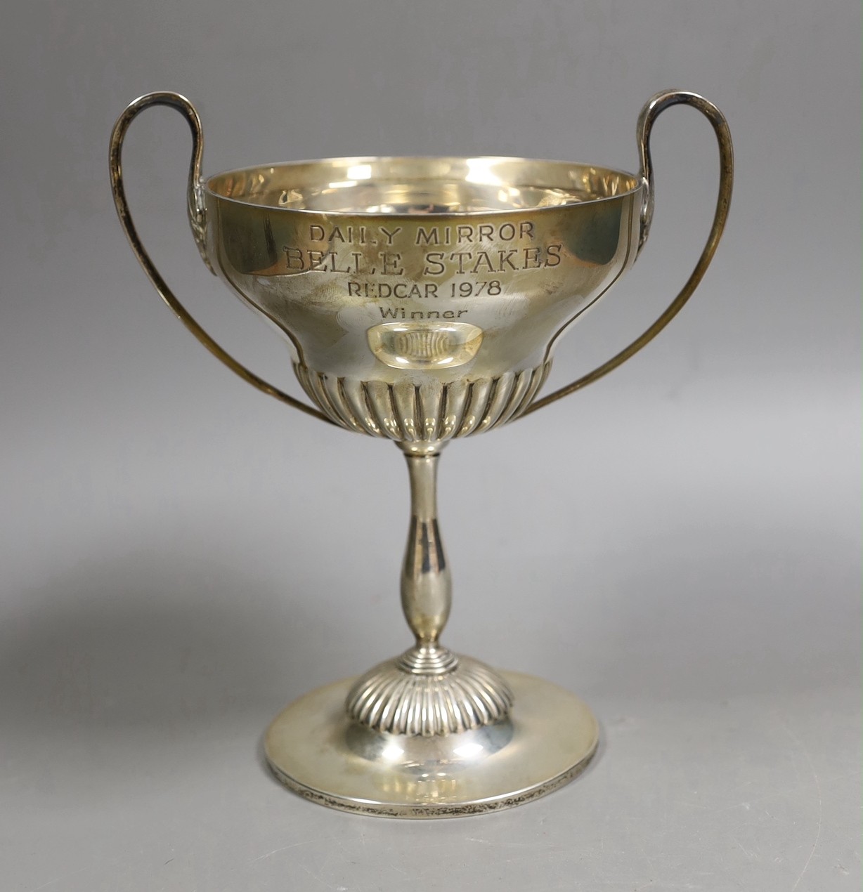 An Edwardian demi fluted silver two handled trophy cup, by Mappin & Webb, Sheffield, 1901, with later engraved horse racing inscription, height 20.1cm, 13.6oz.
